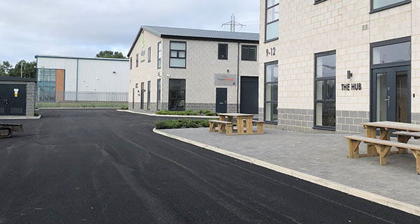 a newly tarmacked road in an industrial estate